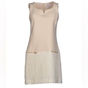 Sleeveless dress in cream with front zipper accent